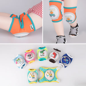 Baby wearing orange and teal knee pads with cartoon print