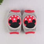 Blue and orange baby knee pads with basketball print