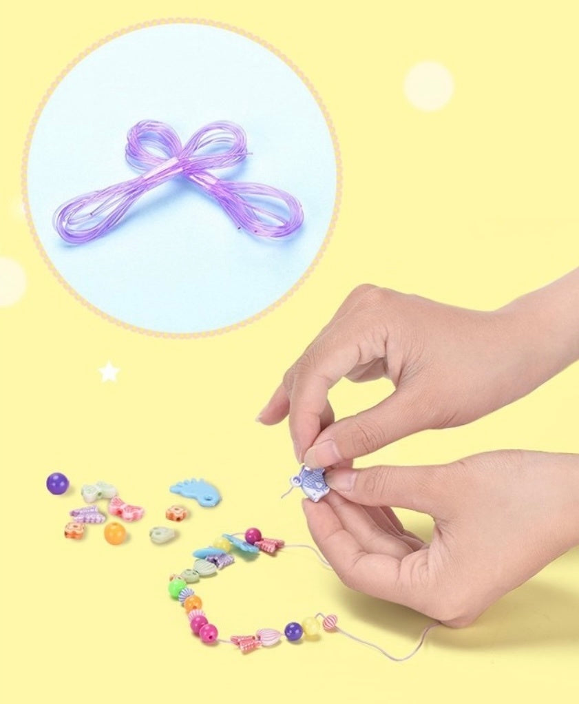 Bright pastel beads in heart, flower, and star shapes for jewelry crafts