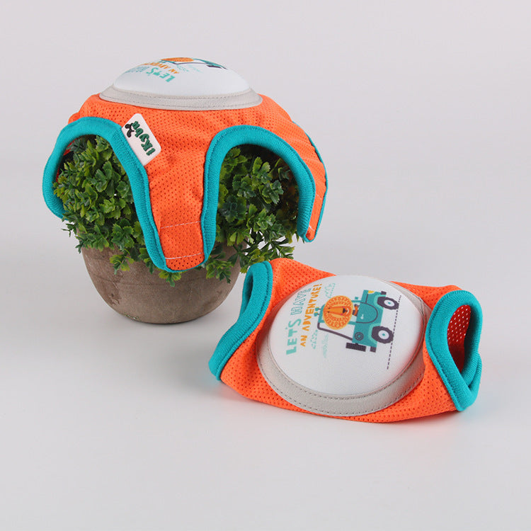 Close-up of baby knee pads in orange and teal colors