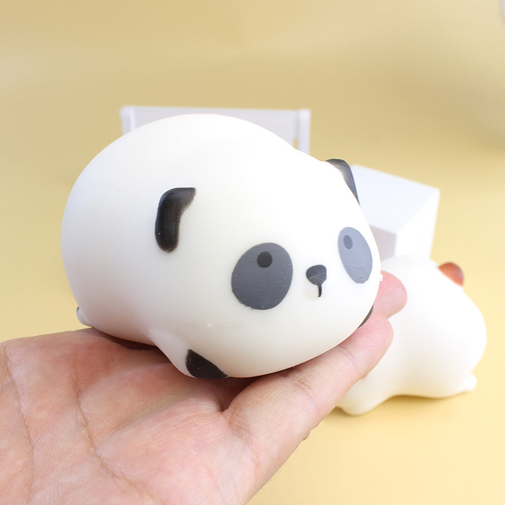 Cute white bear squishy toy held in hand for sensory play