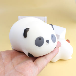 Cute white bear squishy toy held in hand for sensory play