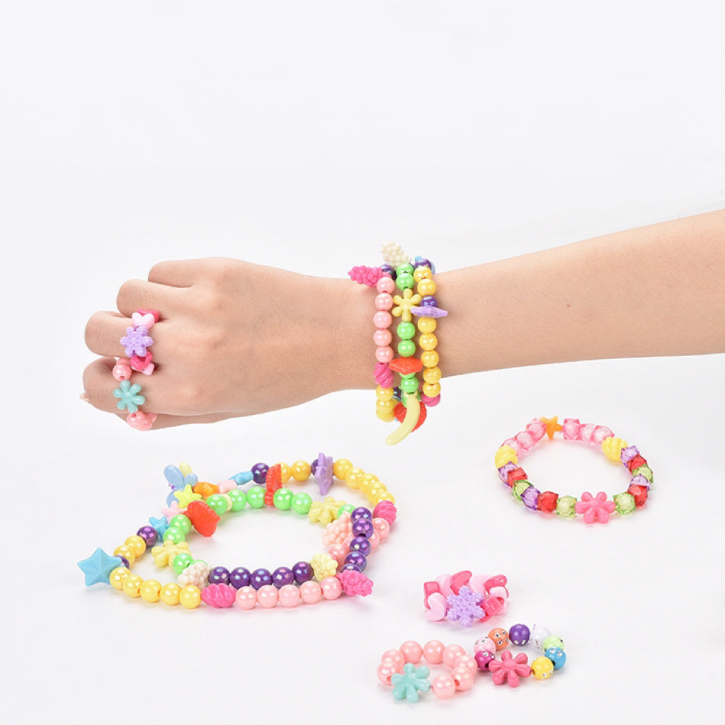 Neatly organized jewelry-making set with assorted beads and charms