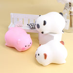 Stacked squishy animals including panda, pig, and white bear