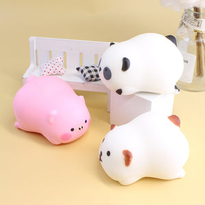 Stacked squishy animals including panda, pig, and white bear