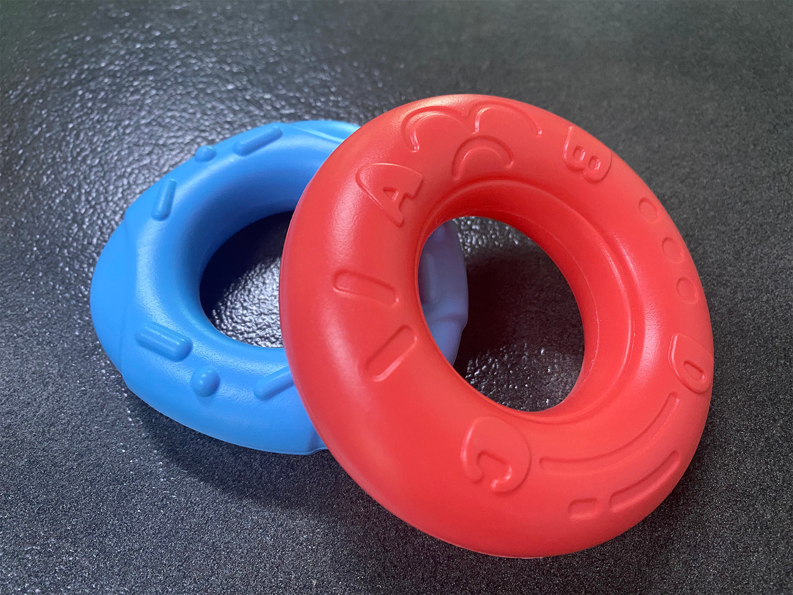 Stacking toy with multi-textured rings for sensory and motor skill development
